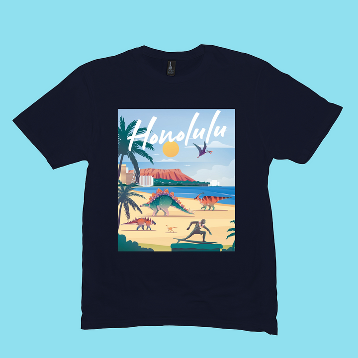 The Men Honolulu T-Shirt by Jurassic Studio is a black 100% cotton tee featuring colorful dinosaurs on a sunny beach with palm trees, ocean, and Diamond Head. “Honolulu” appears in bold white script—great for dinosaur fans.
