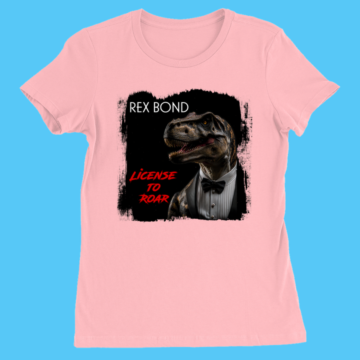 The Jurassic Studio Women Rex Bond T-Shirt features a pink design with a tuxedo-wearing T. rex graphic and REX BOND above License to Roar—a perfect exclusive gift for dinosaur fans.