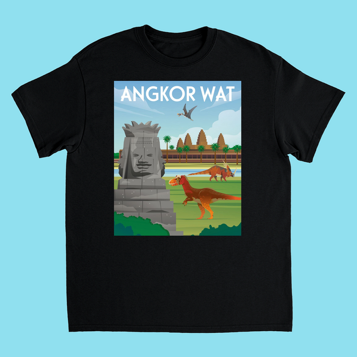 The Kids Angkor Wat T-Shirt by Jurassic Studio features a black tee with ANGKOR WAT text and an illustration of the temple, a T. rex, and a pterosaur among ruins and palm trees under a blue sky.