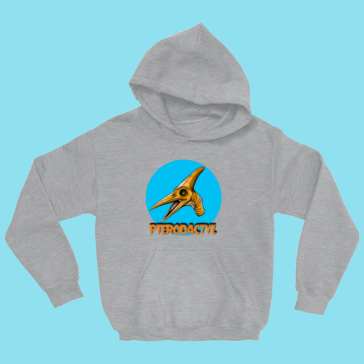 The Kids Pterodactyl Head Hoodie by Jurassic Studio features a gray hoodie with a colorful pterodactyl head inside a blue circle and bold orange PTERODACTYL below, shown on a light blue background.