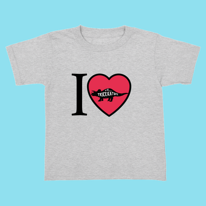 The Jurassic Studio Toddler I Love Triceratops T-Shirt is gray, with I ♥ Triceratops on the front; the red heart includes a triceratops silhouette and TRICERATOPS. Great dinosaur shirt for toddlers.