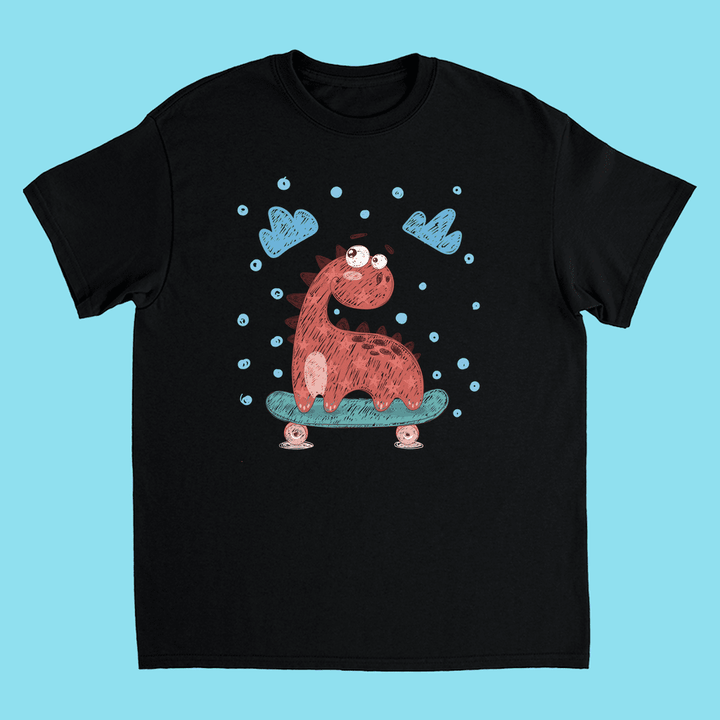 Jurassic Studio’s Kids Baby Dino Skate T-Shirt: black tee with a cute red cartoon dinosaur skateboarding amid blue clouds and dots on a light blue background.