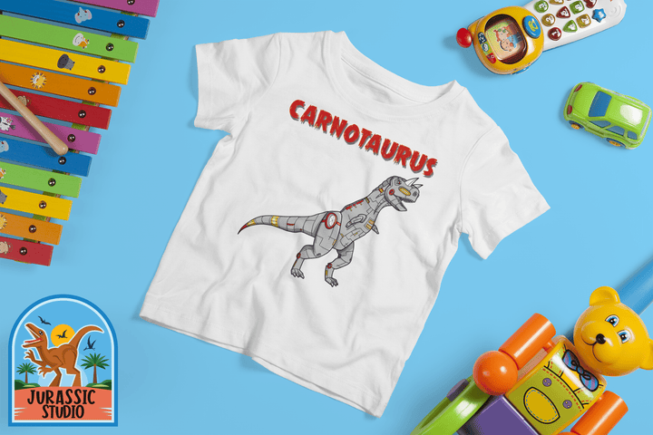 The Jurassic Studio Toddler Robot Carnotaurus T-Shirt showcases a cartoon robotic dino with bold red text, surrounded by colorful toys—a fun gift for any dinosaur fan.
